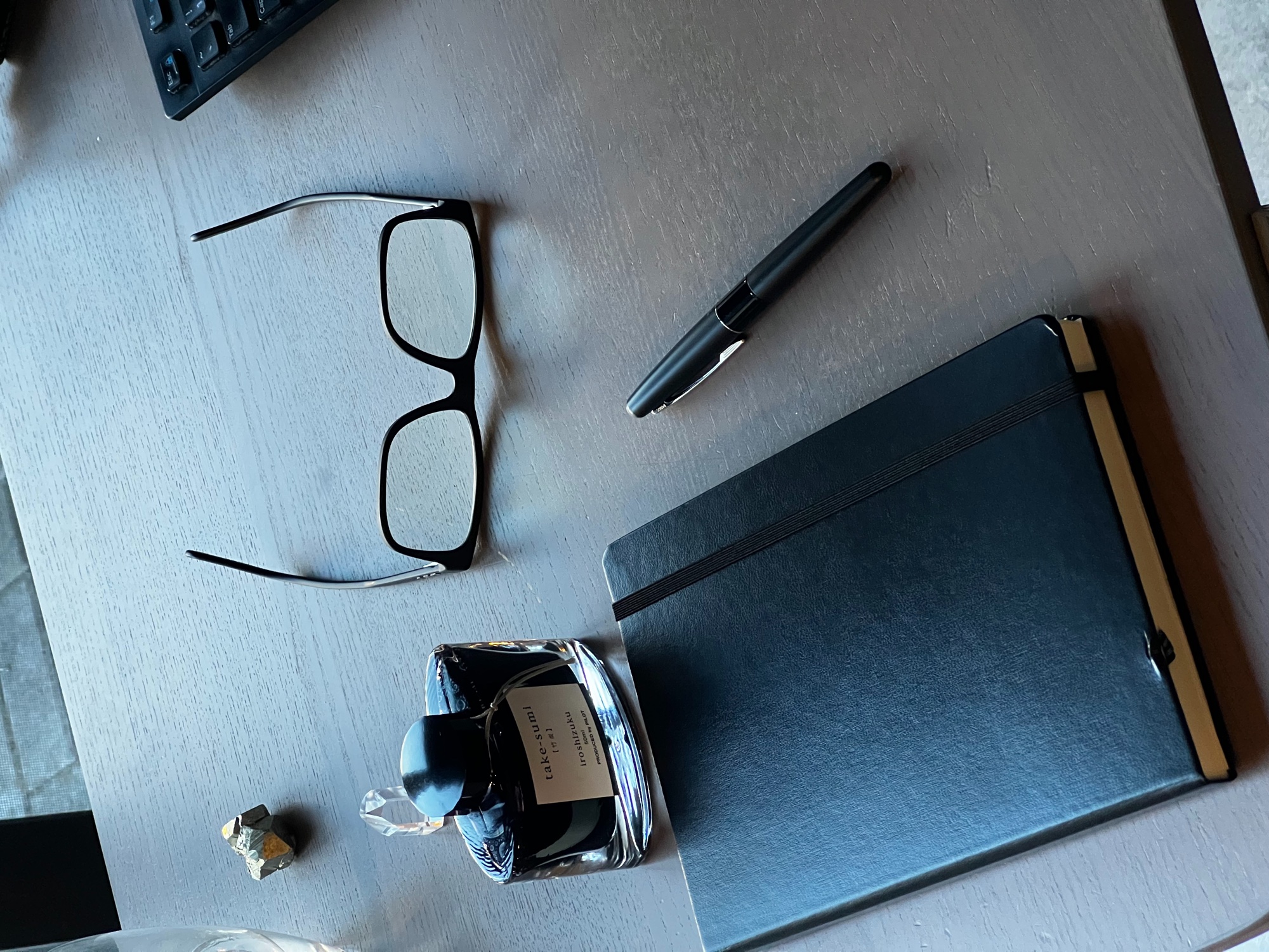 Notebook and pen on the desk where a project starts